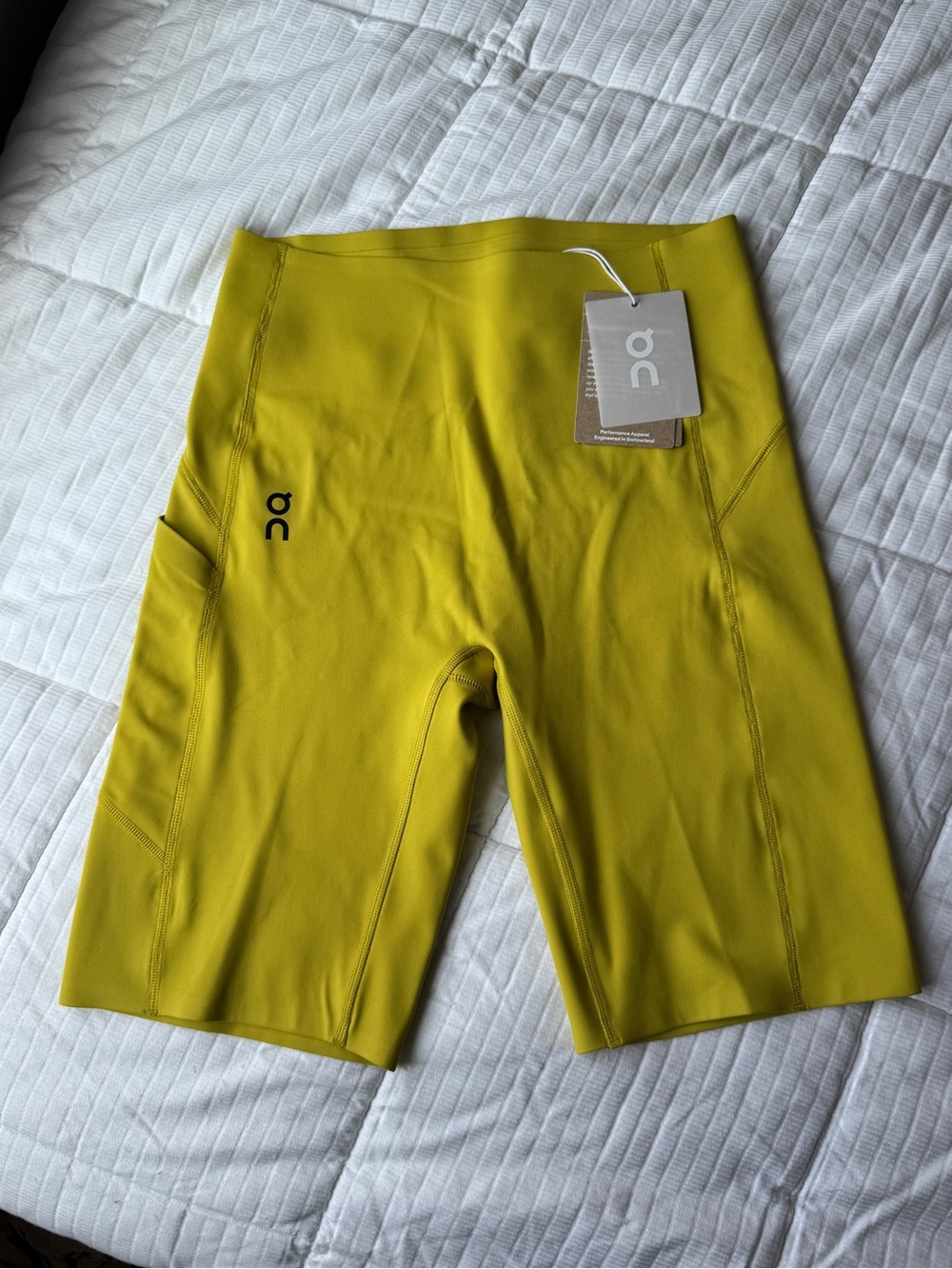 On Running yellow biker shorts with pockets size S